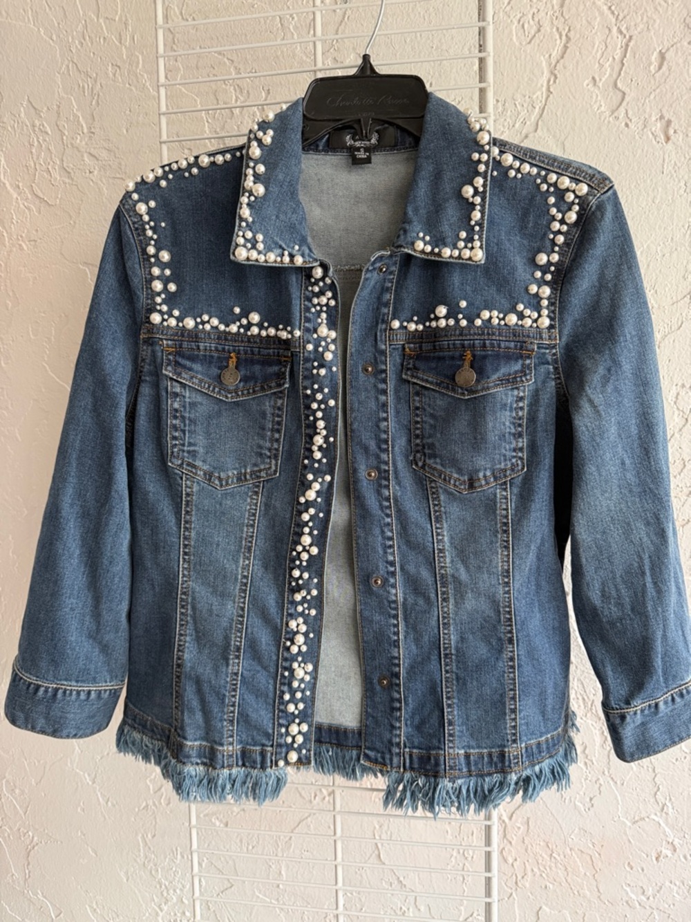 Denim jacket pearl embellishment